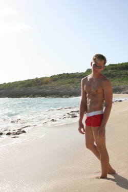 scenicboys:  ScenicBoy Garet @ Coupecoy Beach, SXM Loving every minute of this hot Caribbean day! Another rum-punch, please! 