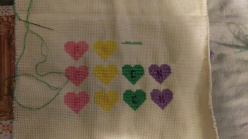 Cross stitch in progress. Candy coated fucks given for everyone. I’m debating a border but I m