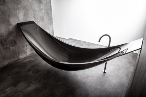 sixpenceee:  Splinter Works may have created the ultimate way to relax with Vessel, a new and elegant take on the modern bathtub. The design resembles the imagery of a hammock, and is constructed out of carbon fiber for its strength and ability to form