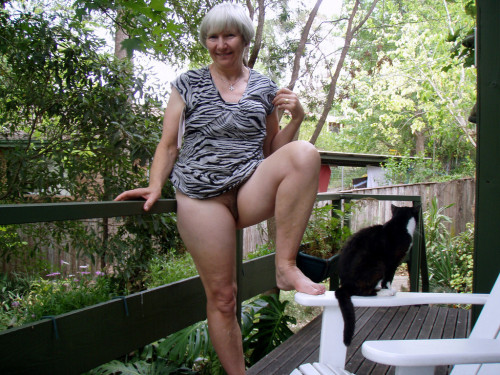 jemcasey:  Lyn, our lovely Australian granny gets naked on the deck…   Who could resist bending her over that rail and giving her hairy cunt a thorough drilling? Even though pussy seems indifferent to mistress’s charms!