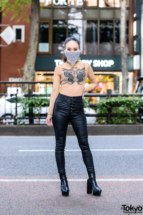 Japanese nurse Saya on the street in Harajuku wearing a chainmail face mask with a sheer top by I.Am