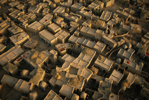 unrar:  Rice set out to dry on the rooftops of the Dogon village of Sanga, Mali,