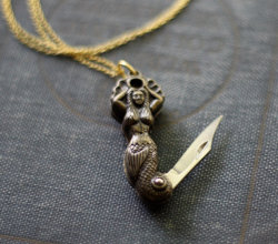 areallybigbagofdicks:  wickedclothes:  Mermaid Pocket Knife Necklace This mermaid isn’t what she appears to be at first look, much like the legends claim. Sold on Etsy.  oh my goooooood &lt;3___&lt;3 