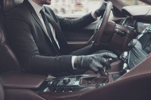 A well fitted suit, well fitted gloves, and a beautiful car. Well done. -B