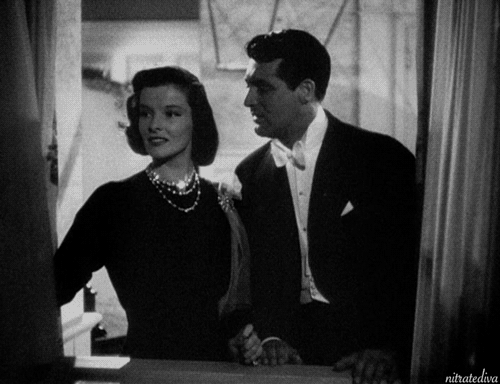 Cary Grant gives Katharine Hepburn a New Year’s kiss in Holiday (1938). #1930s#cary grant#katharine hepburn#holiday#george cukor #happy new year  #new years eve  #new years kiss #kiss#classic film#classic movie#gif #classic movie gif