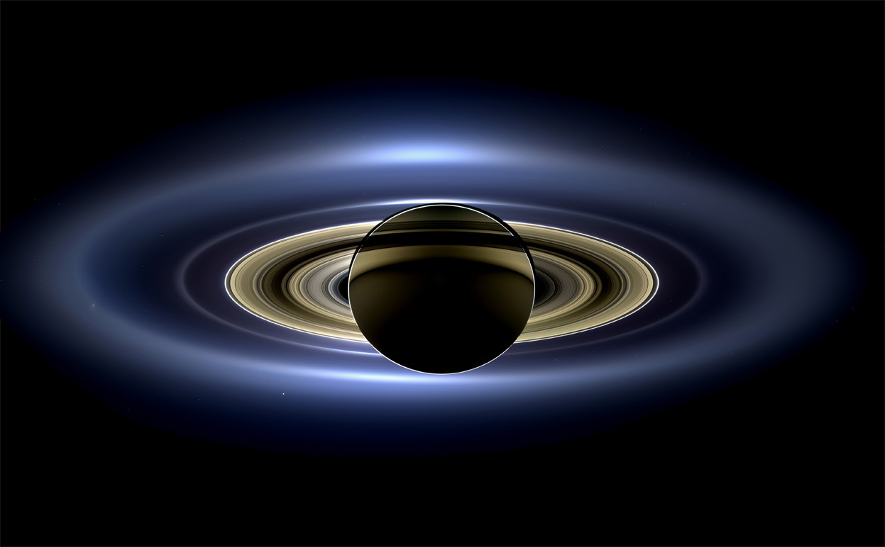 From 2013: The Year in Photos, May - August, one of 40 photos in this essay, part 2 of a 3-part summary of 2013. In a natural color mosaic, Saturn eclipses the Sun as seen by NASA’s Cassini spacecraft on July 19, 2013. This image spans about 404,880...