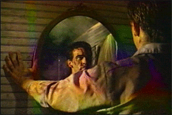 thedeaditeslayer:Bruce Campbell acts with his double for the mirror scene in Evil Dead 2.