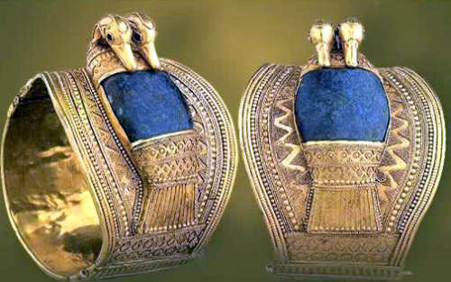 Solid gold bracelets set with lapis lazuli and bearing the cartouches of Ramesses II