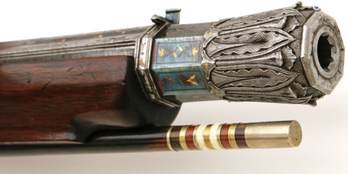 A heavily engraved and chiseled percussion muzzleloading rifle crafted by Giacomo Rinzi of Milan, ci