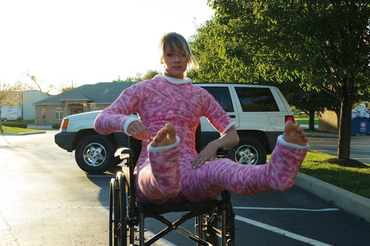 Blonde Girl in full body cast and wheelchair outdoor