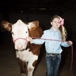 brianfinke:  Halee Johnson walks her cattle towards the judging ring at the 66th Annual Randall County Junior Livestock Show in Canyon, TX. Covering all aspects of America’s love affair with beef - @brianfinke for @natgeo #onassignment #meat 