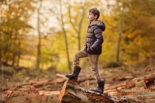 Portrait of a tween boy in autumn By RebeccaSpencerAvailable to license exclusively at Stocksy