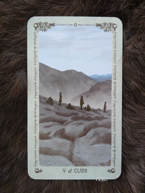 Lord of the Rings Tarot: V of Cups: The Fellowship grieves the loss of Gandalf[ID: a photo of a digi