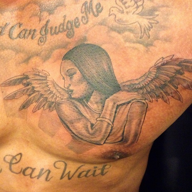 Pau  Black Ink Baby Angel Tattoo On Right Back Shoulder