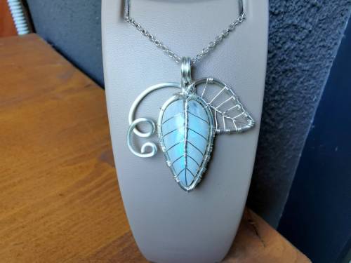 Leaf with vines pendant made with a moonstone :).You can order it at my Etsy shop: https://etsy.me/2