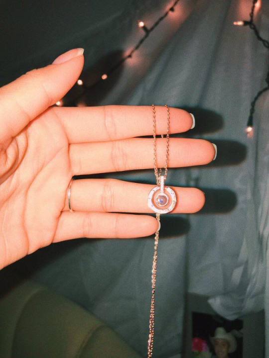 My boyfriend surprised me with a necklace and with a 24K golden rose today and if you look inside the necklace, it says "I love you" in 100 languages.