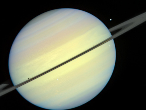 humanoidhistory:The planet Saturn and moons, observed by the Hubble Space Telescope in 1995.(HubbleS