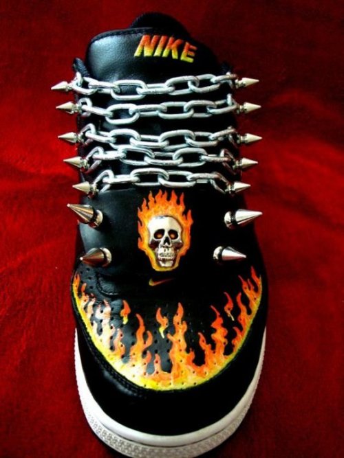 Hand painted ‘Ghost Rider’ custom Nikes with custom spikes, emblem and chain ‘laces.’ These have SOL