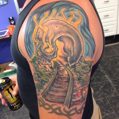 This conductor wanted to bring the train tracks into a skull cave. This is what we came up with. No I didn’t do the tribal band. #tattoo #neotradsub #pixelsandpints #msdixiestattoo #skull #train