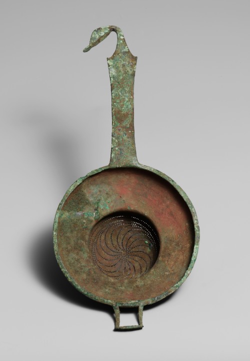 Etruscan strainers at the MET. All the shown examples date to the 6th-5th centuries BCE and are made