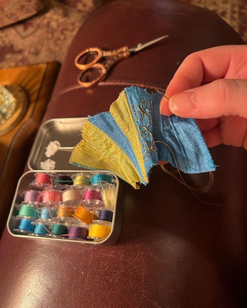 My little prayer for the world is being made as I make this tiny doll corset in the colors of Ukrain