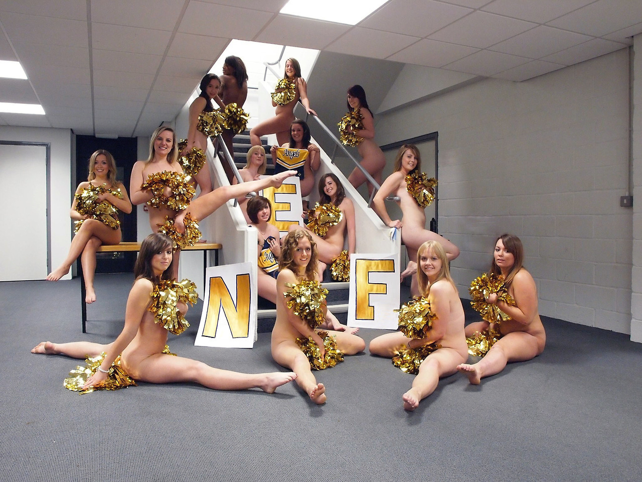 nakedenfcaptions:After the cheerleaders lost the bet, they had to pose for the yearbook