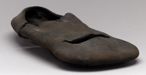 Shoes, 16th century English Black leather These glorious pieces of footwear excavated from an archae