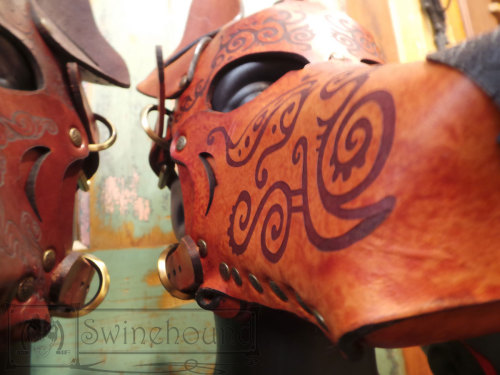 misterswinehound:  Two dog masks for the Anthrocon art show. The design engraved on these was created by my partner-in-artistic-crime over at http://bonepile.tumblr.com/.  We put the masks together.  I think they came out really great.