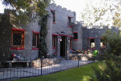 magicalandsomeweirdhometours: This castle-like house is built entirely of empty embalming fluid bott