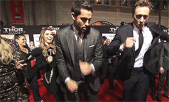 tomhazeldine:  Zachary Levi and Tom Hiddleston having a dance off on the red carpet