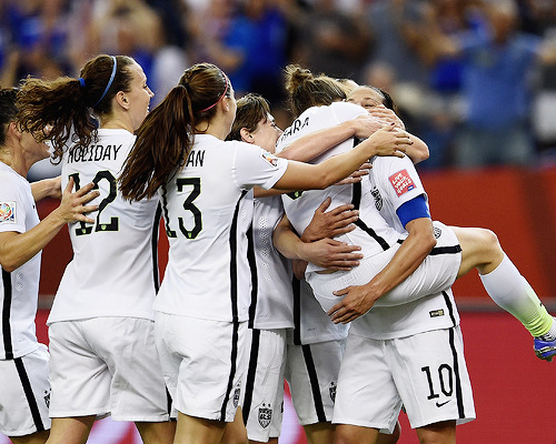 daily-football: Kelley O'Hara of the United States celebrates with team mate Carli Lloyd as she scor