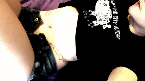 DayDream crops this photo to show off her batman inspired ink. 