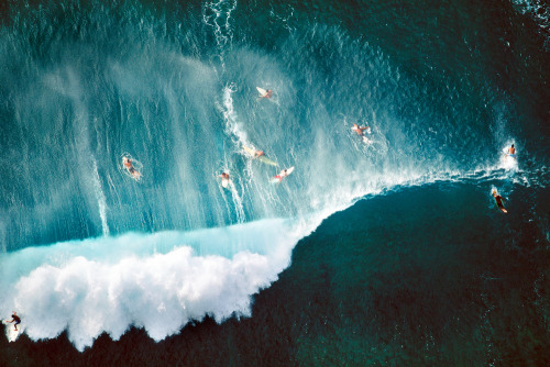 alex-maclean:  Alex S. MacLean, Surfers Behind Breaking Wave at Sunset Beach, Oahu, HI, 1998.