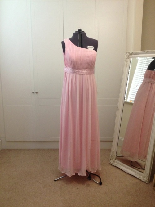 This Prom Dress alteration was a hem, bodice and sash reduction. We hand finished the gown and steam