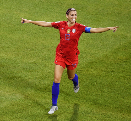 Alex Morgan celebrates her goal during the match vs. England