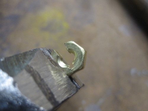 I needed to find a low cost, and easier to machine, single tube version of the Teflon guide tube holders I made. An alternative is splitting 5-40 brass nuts and soldering them onto the guide rails. Since Teflon is a highly interlaced polymer, it does