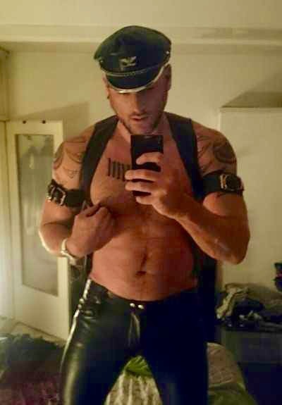 Porn photo Leatherman playing with his nips