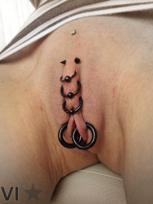 pussymodsgalore:  pussymodsgalore  Pierced outer labia closed by rings. Chastity piercing.  