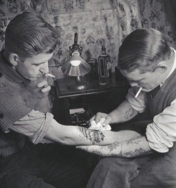 wehadfacesthen:  Sailor gets a tattoo, 1920s