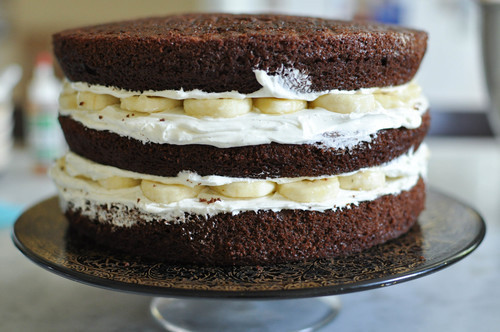 sweetoothgirl:  Chocolate Banana Cake w/ Vanilla Bean Butter Cream  