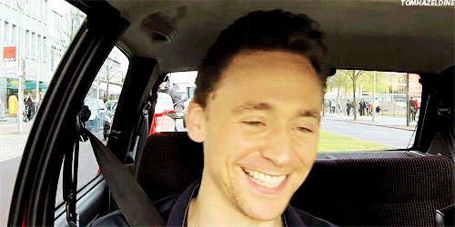 tomhazeldine:  tom + giggling in a car 