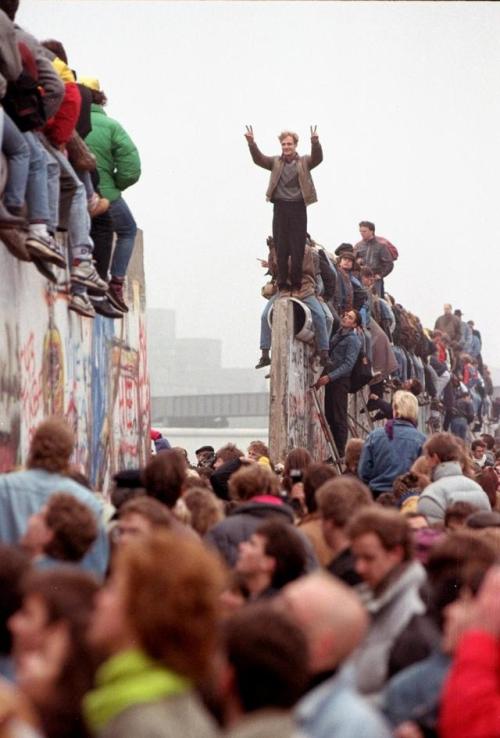historicaltimes:Germans celebrating the fall of the Berlin Wall at Potsdamer Platz, 12 November 1989