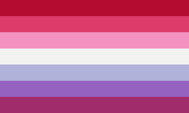 A seven striped pride flag. In order the stripes are red, hot pink, baby pink, white, light blue, blue, and dark purple.