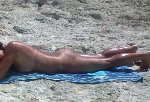 My wife on a nüde beach!Make sure she rolls over to tan evenly and not burn (and take more pict