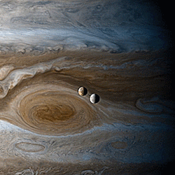 ufo-the-truth-is-out-there:   Timelapse of Europa & Io orbiting Jupiter, shot from Cassini during its flyby of Jupiter 