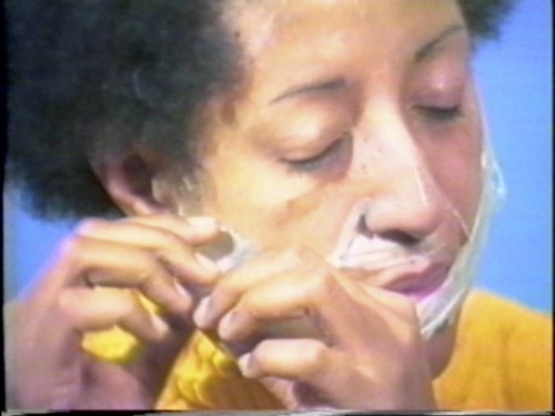 Speaking directly to the camera, artist Howardena Pindell recounts her experiences of racism and sex