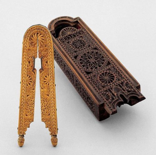 Pinenut Cracker in casket, 19th Century. Fruitwood and walnut with richly carved geometrical decor. 