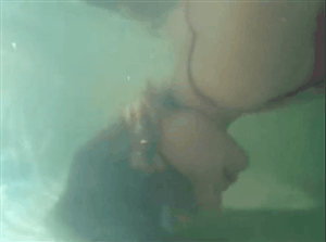 Women Blowing Bubbles Underwater
