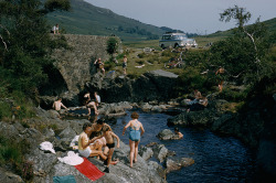 natgeofound:  Bikes park near an arched stone