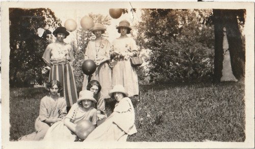  “Bunch of Balloons” - a group of young ladies posing at a park with rubber balloons on sticks, poss